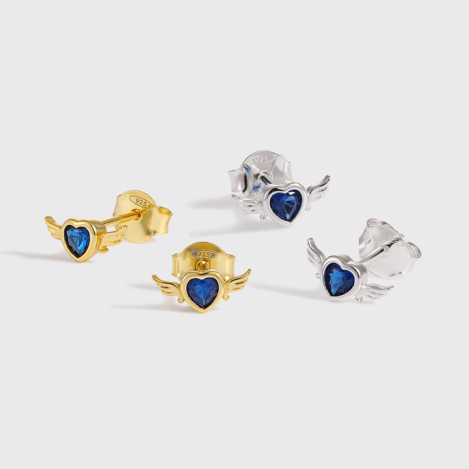 Blue CZ Flying Heart Stud Earrings - 925 Silver & 18K Gold
